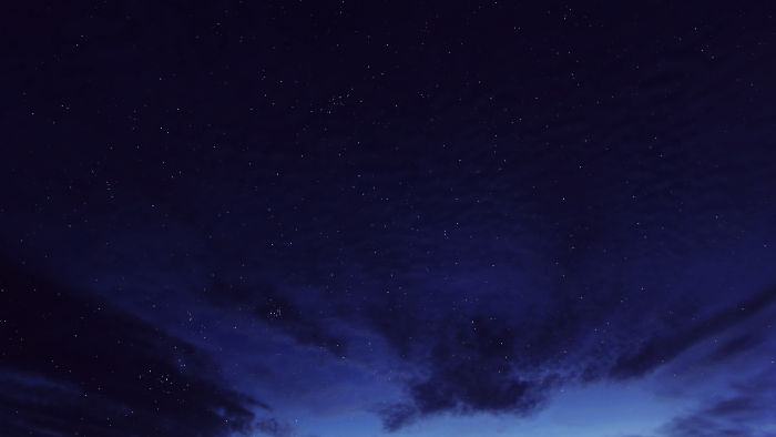Starry night sky with clouds