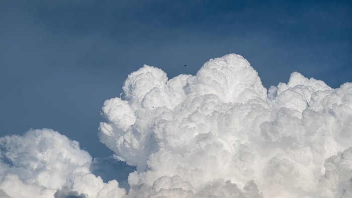 Towering Cumulonimbus Clouds Against a Blue Sky