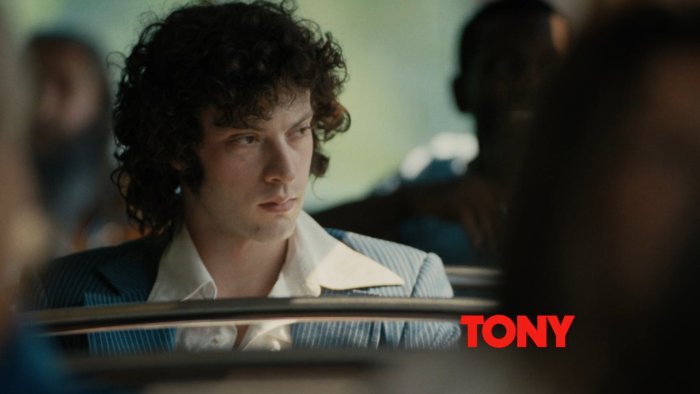Tony movie title card with a man in a suit