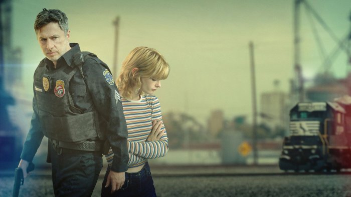 Police Officer and Young Woman with Train