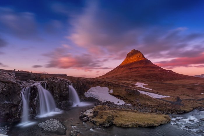 Kirkjufell mountain and waterfall at sunset