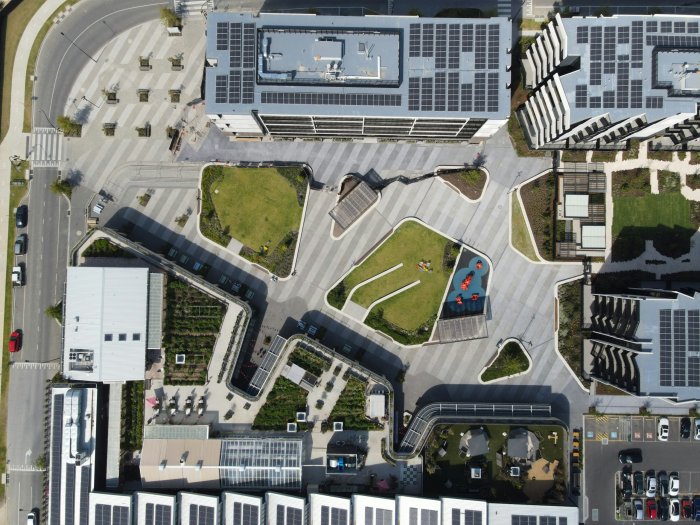 Aerial view of a modern urban development with solar panels