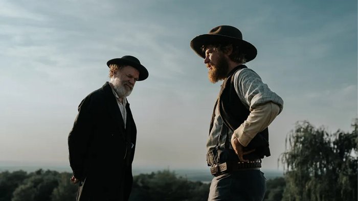 Two men in hats in a field