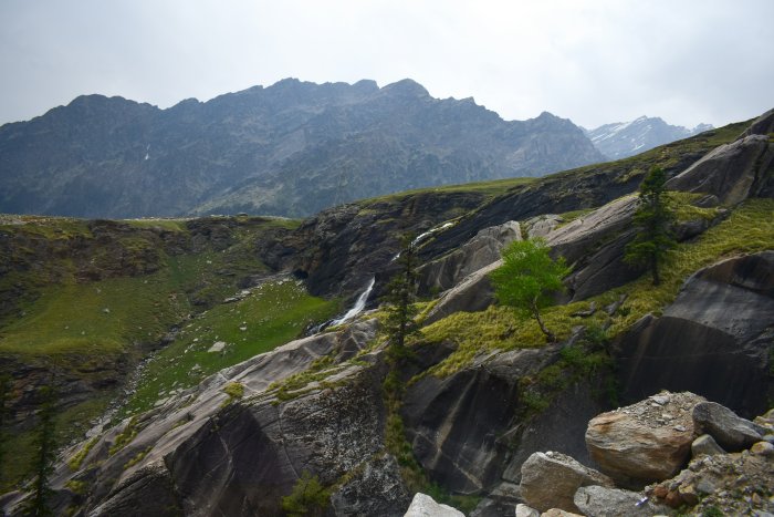 Mountain landscape with a waterfall and trees