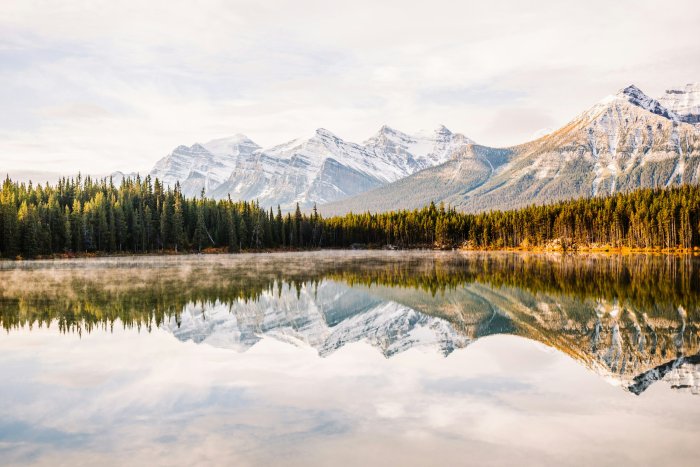 Snow-capped mountains reflected in a calm lake