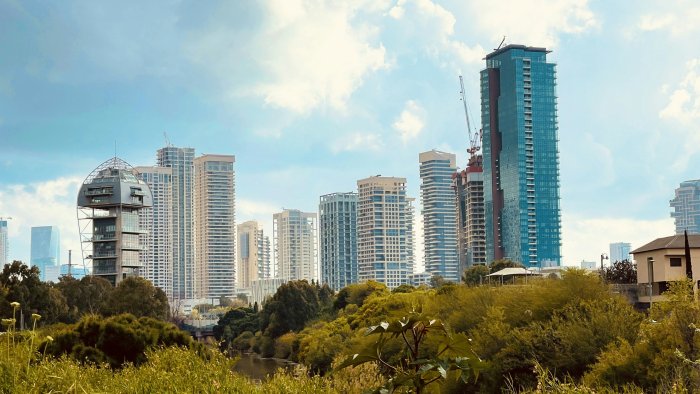 Tel Aviv skyline with lush greenery in the foreground