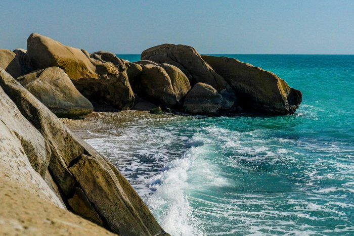 Rocky beach with turquoise ocean waves