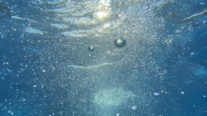 Underwater bubbles with sunlight