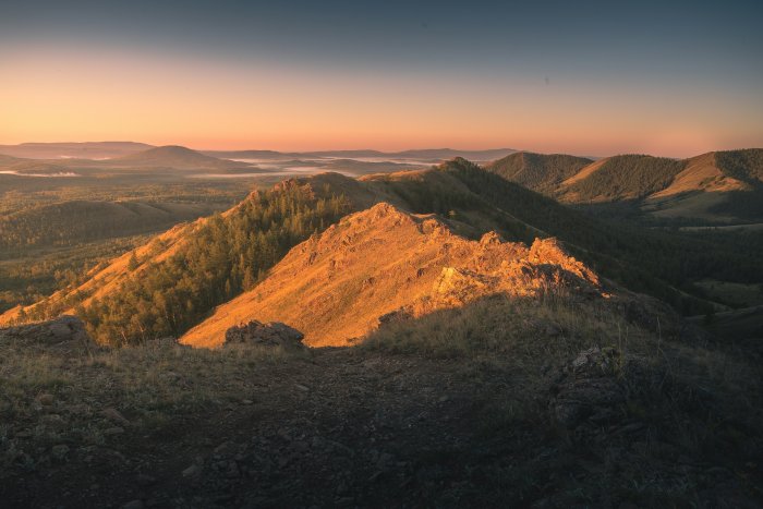 Mountain peaks bathed in golden sunrise light