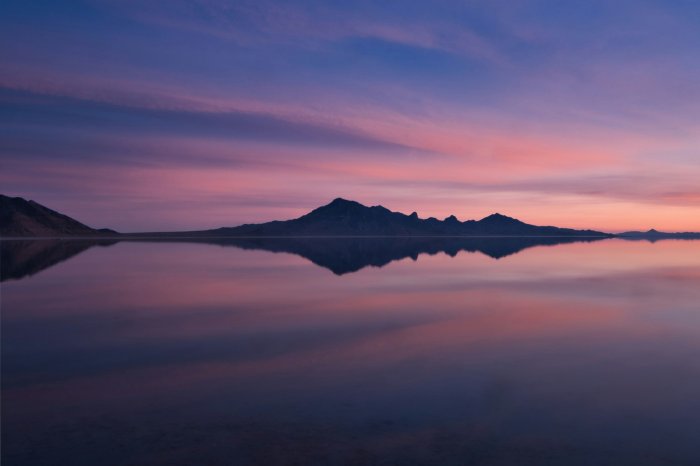 Mountain reflection at sunset over a calm lake