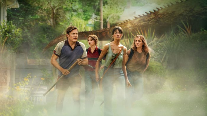 Family running from a monster in The End of Oak Street