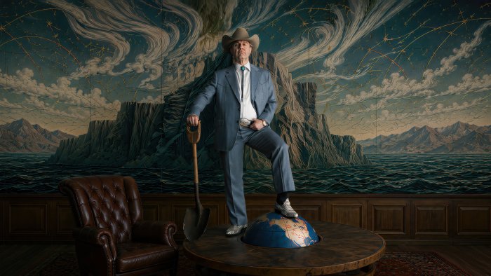 Man in Suit with Shovel Standing on Globe