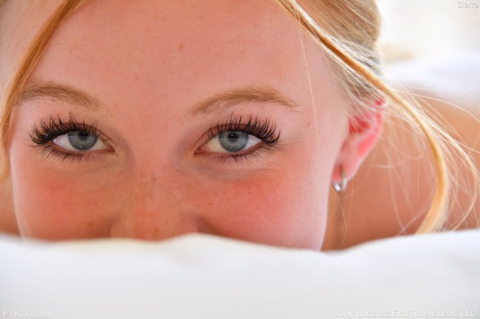 Close-up of Sierra's blue eyes and freckled skin