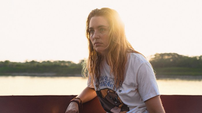 Woman on a boat at sunset