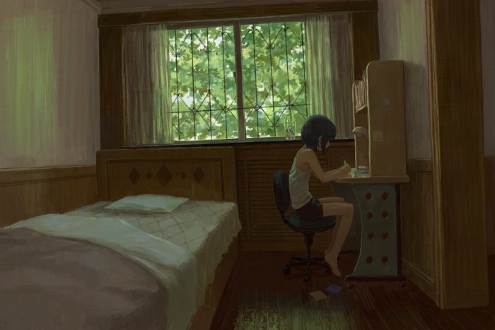 Girl studying at a desk by a window