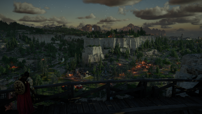 Assassin's Creed Valhalla: Eivor overlooking a settlement