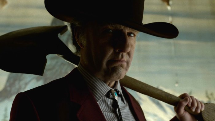 Man in cowboy hat with shovel