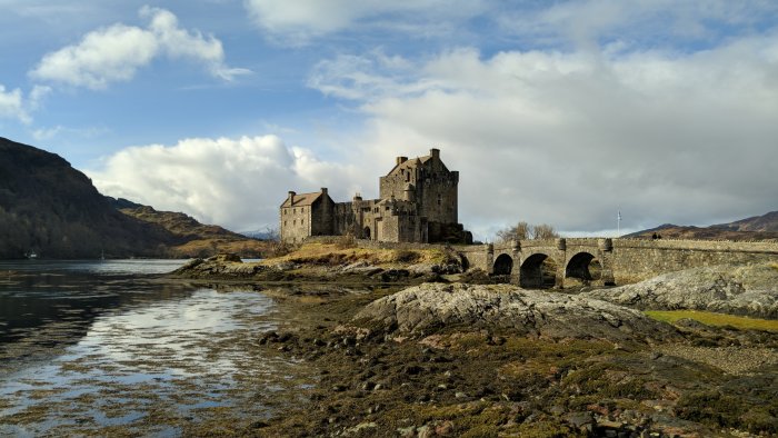 Eilean Donan Castle on a rocky island with a stone bridge