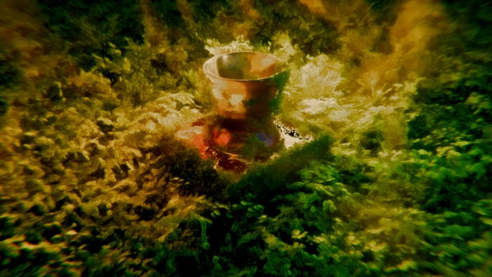 A chalice in a textured, abstract natural setting
