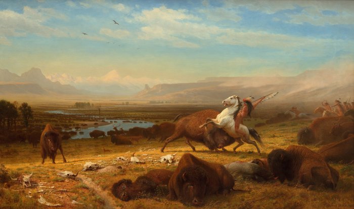 Native American hunting buffalo on horseback