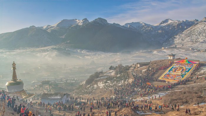 Buddhist Thangka Unveiling Ceremony in Snowy Mountains