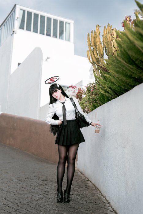 Anime girl in school uniform holding a drink