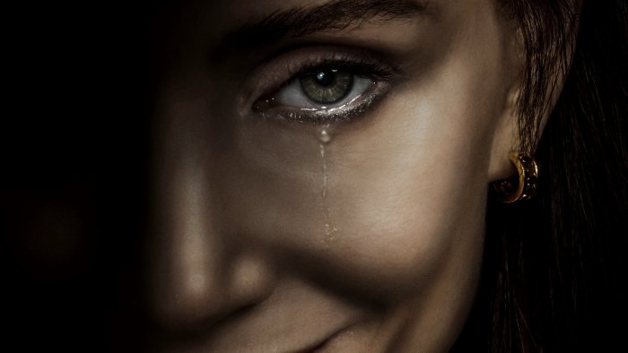 Close-up of a woman's eye with a tear