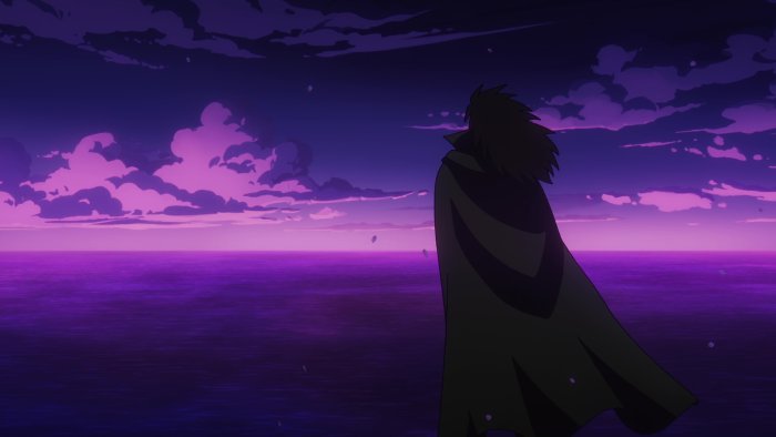 Man in Cape Overlooking Purple Ocean at Dusk