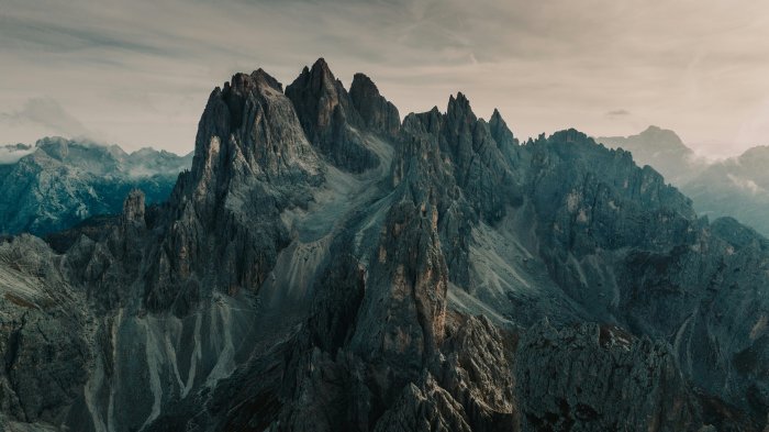 Jagged mountain peaks under a cloudy sky