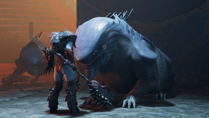 Warrior facing a large creature in a dark environment
