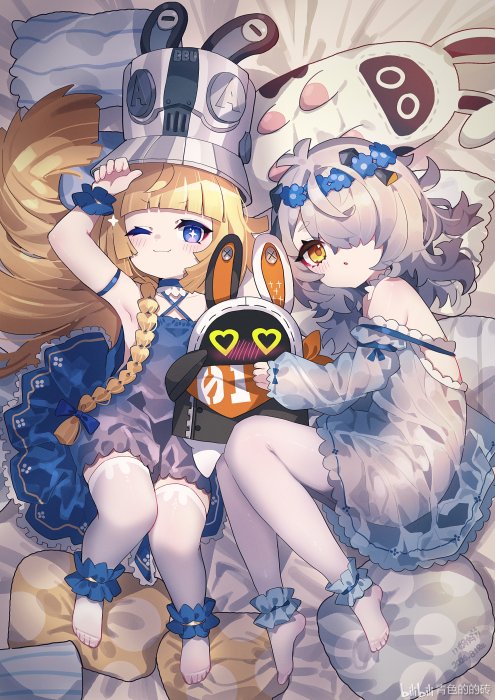 Two girls in bunny ears with a robot bunny plushie