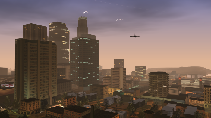 Cityscape with skyscrapers and a plane at dusk