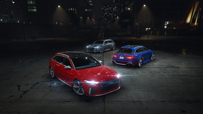 Three Audi RS6 Avant cars at night in a city