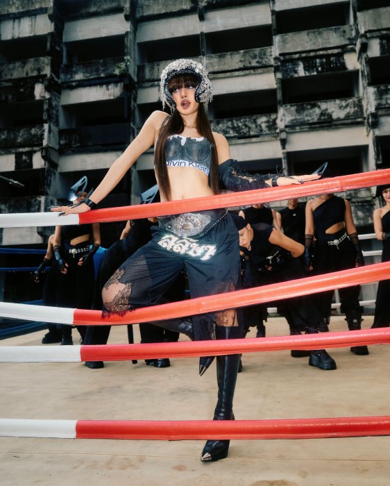Woman in boxing ring with Calvin Klein outfit