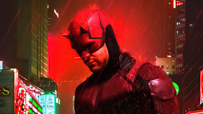 Daredevil in a red suit in a city at night