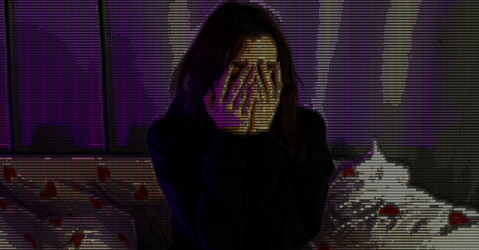 Woman covering face with hands, pixelated effect