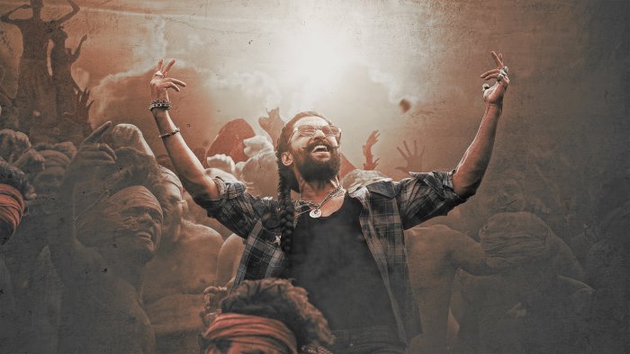 Man with arms raised in a crowd