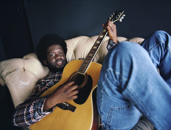 Michael Kiwanuka with acoustic guitar