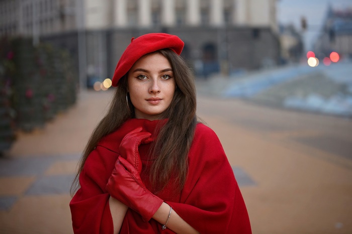 Woman in red beret and coat