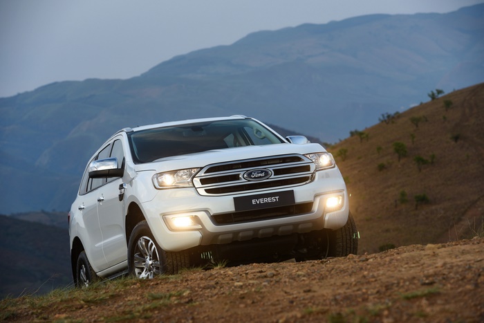 White Ford Everest SUV on a dirt road