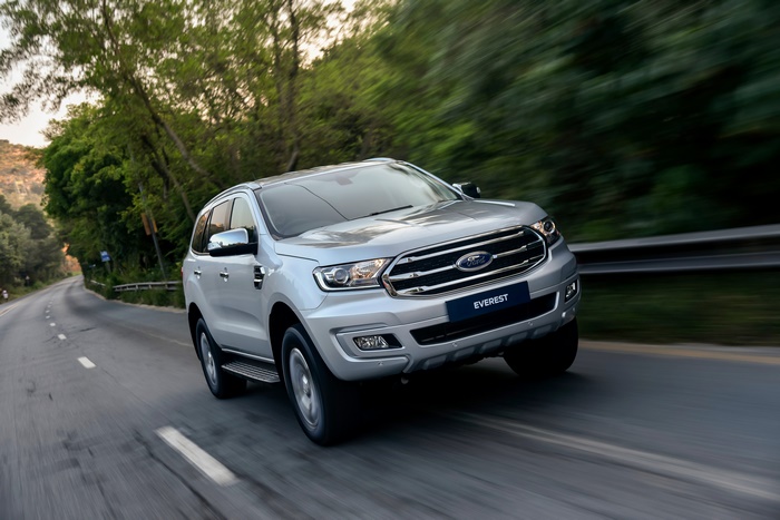 Silver Ford Everest SUV driving on a road