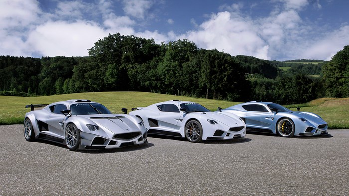 Three Mazzanti Evantra Millecavalli sports cars on a road