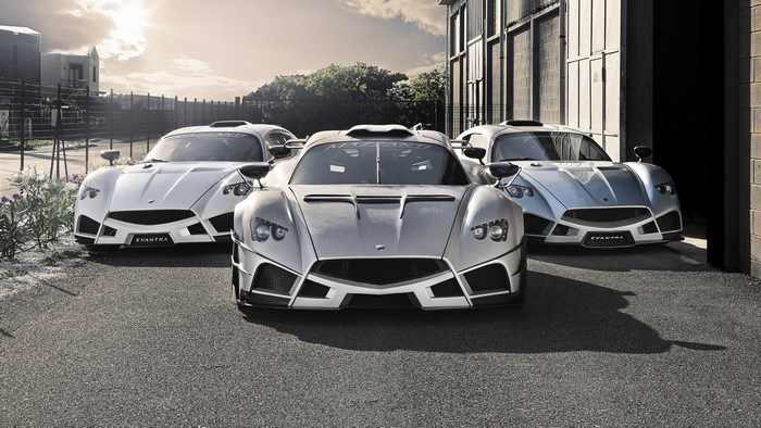 Three Mazzanti Evantra sports cars parked outside