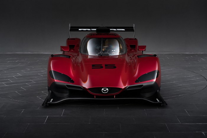 Red Mazda RT24-P race car with number 55