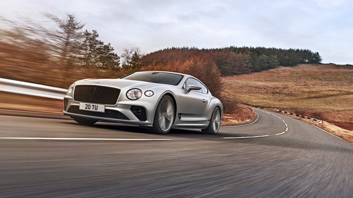 Silver Bentley Continental GT Speed on a Winding Road