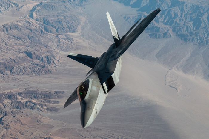 United States Air Force F-22 Raptor in flight over desert