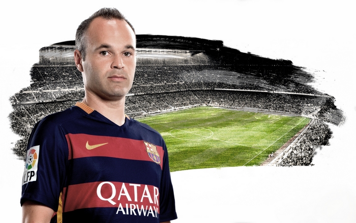 Andrés Iniesta in FC Barcelona uniform with stadium background