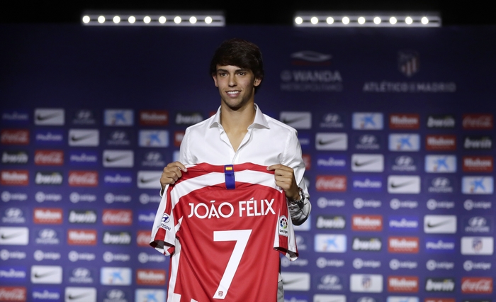 Joao Felix holding Atletico Madrid jersey