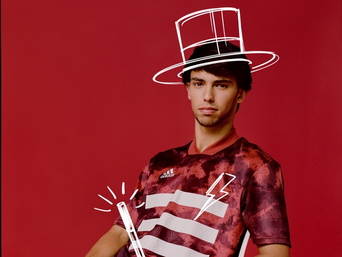 Joao Felix wearing Adidas jersey with drawn hat and magic wand