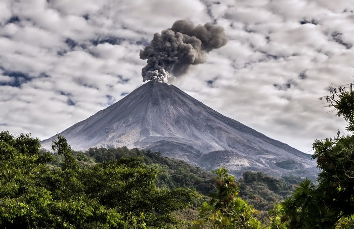 Volcano erupting with smoke and ash